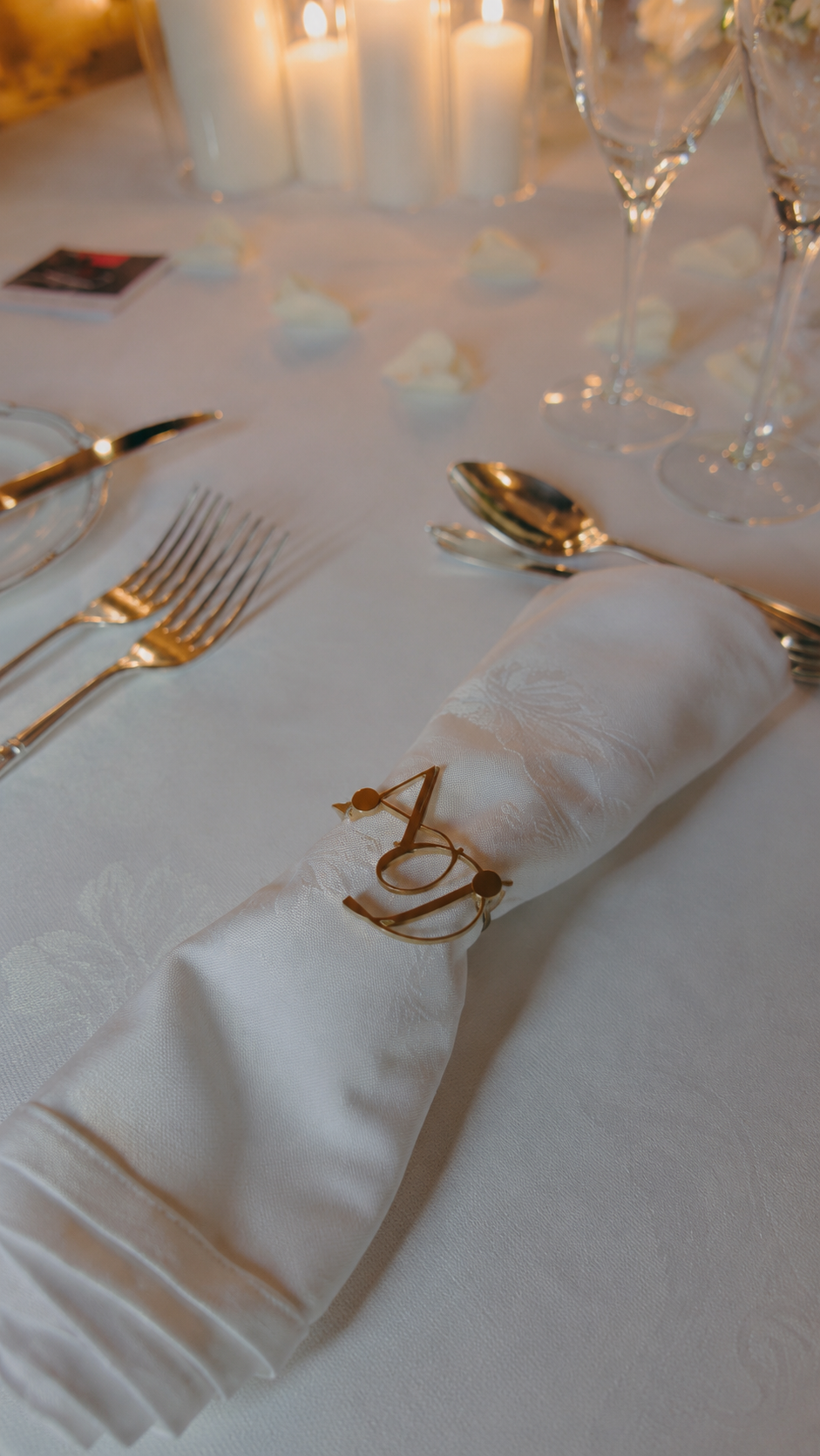Bespoke monogram napkin ring shown on a formal dining table setting