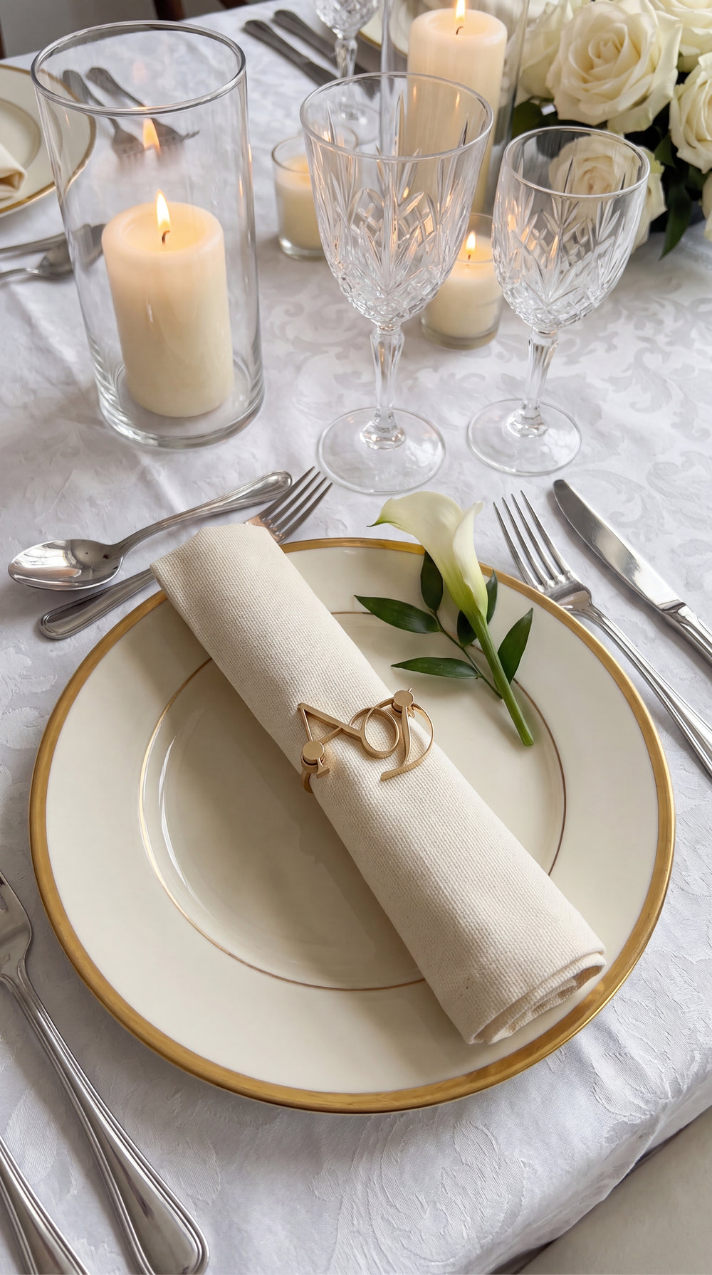 Personalised monogram napkin ring on a rolled linen napkin with white florals
