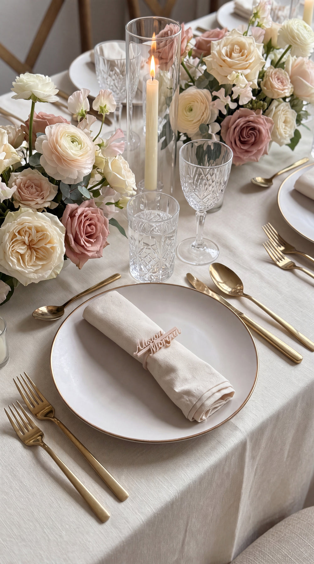Personalised name napkin ring in cream script on an ivory linen napkin