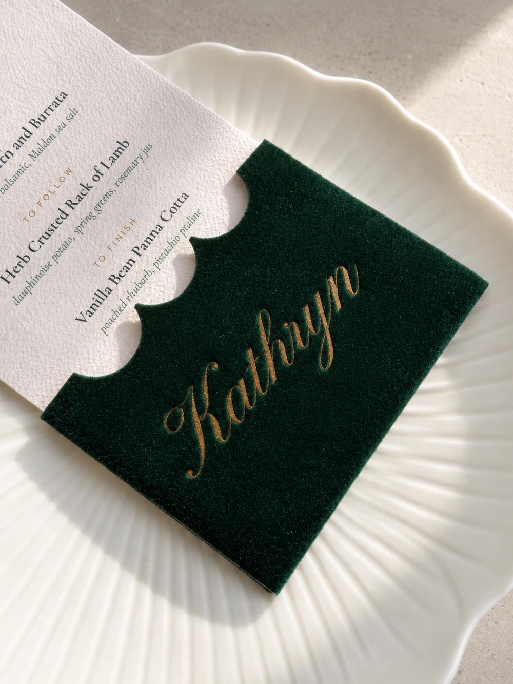 Green velvet place card and menu, personalised with an engraved guest name