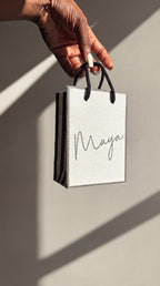 luxury handmade personalised gift bag with custom vinyl design ribbon and charm for event