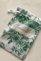 emerald green satin personalised keepsake bag with gold text for wedding favour