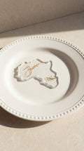 clear resin Africa silhouette place card with personalised gold guest name on plate