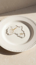 clear resin Africa silhouette place card with personalised gold guest name on plate
