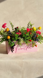 luxury faux floral and fruit centrepiece in painted wooden box for wedding table